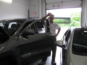 Owner and DIY Solar Consultant prepares for test drive of Jeep Cherokee Electric Conversion